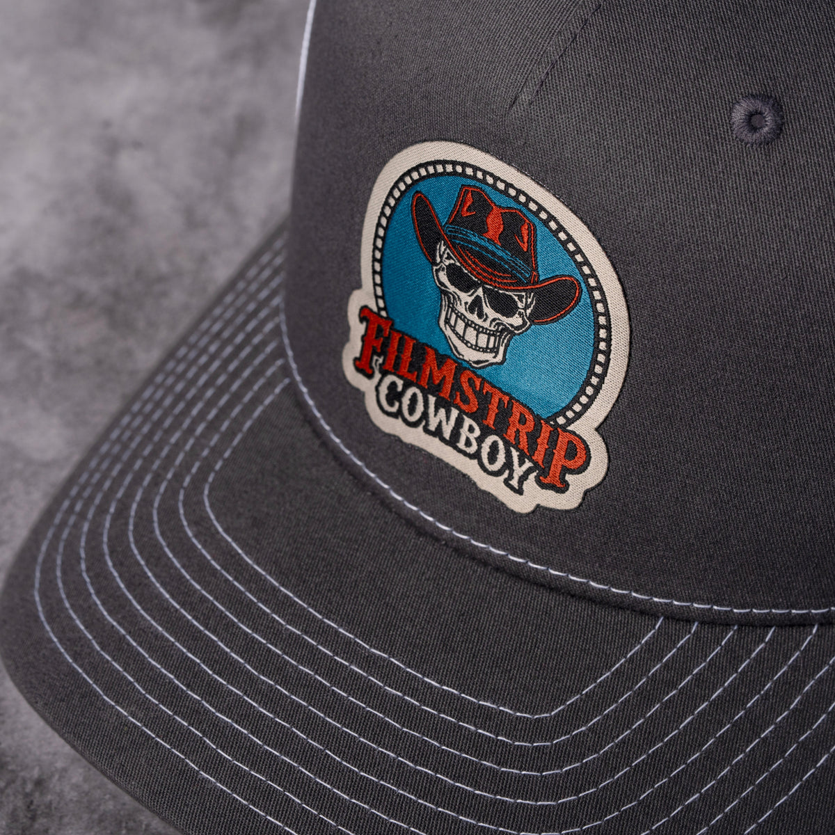 Filmstrip Cowboy™ Gray Trucker Hat