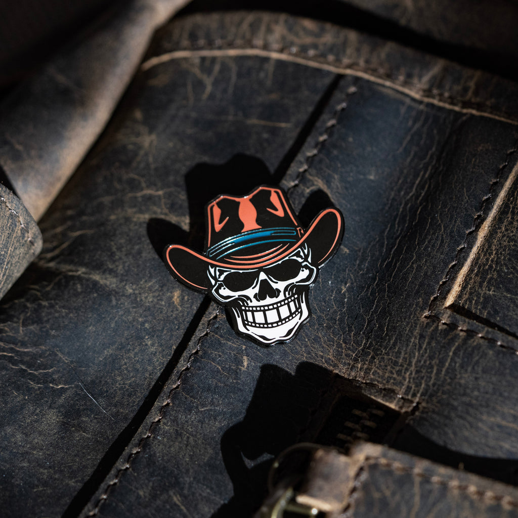 Filmstrip Cowboy™ Enamel Pin